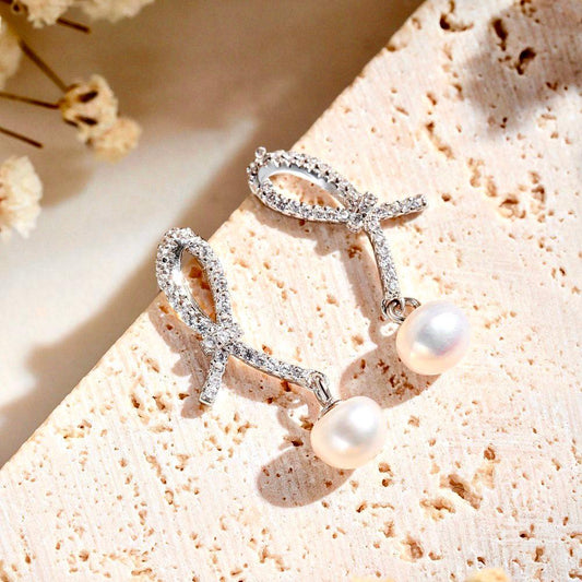 orecchini_in_argento_con_perla_a_fiocco - cucciolagioielli